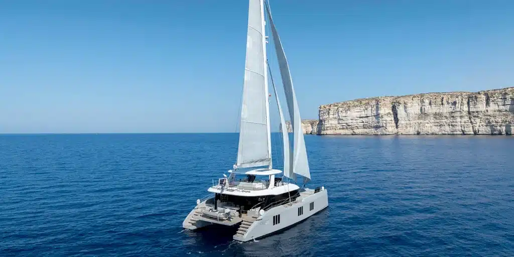SEA-BLISS-Luxury-Sailing-Catamaran-Charter-Yacht-Sunreef-70-Aerial-View-Stern-Sailing
